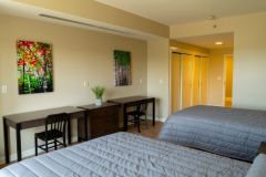 Our double bedrooms include two desks, a restroom, and closets for easy organization.