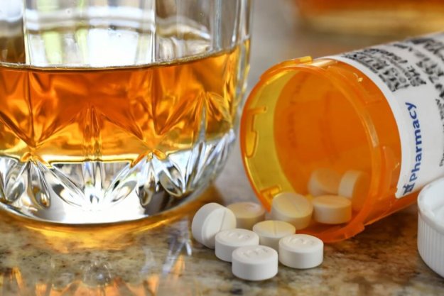 A young man taking an antidepressant.