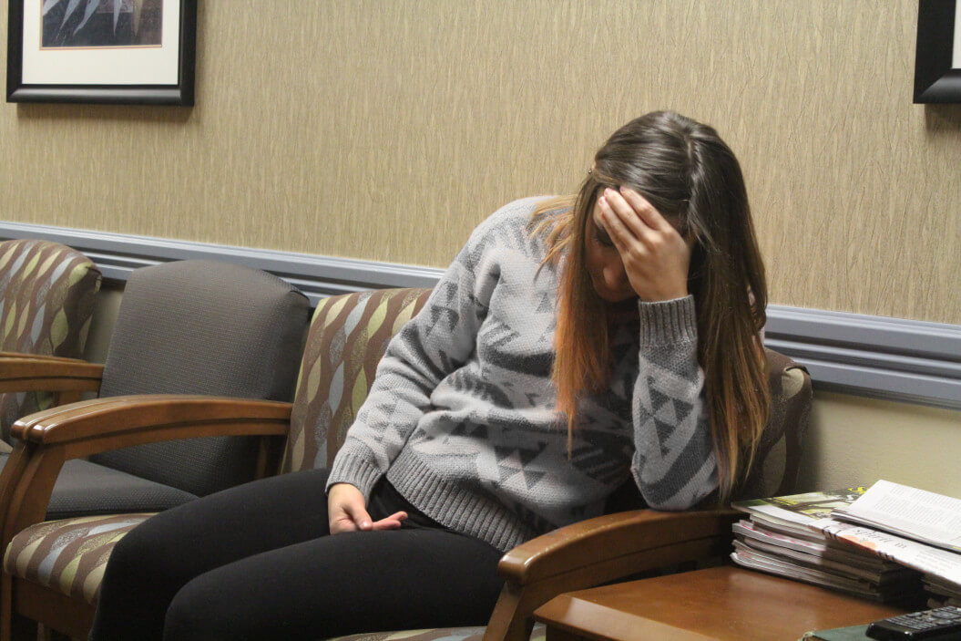 A young woman who experienced trauma seeks help from an addiction professional.