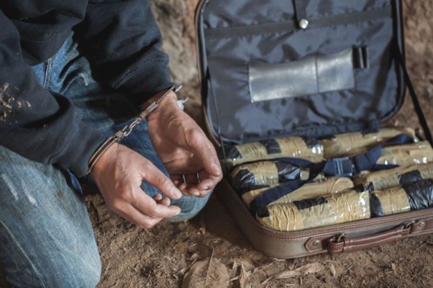 The Battle Against Drug Trafficking in Ohio A drug trafficker in Ohio being arrested for trying to sell heroin.