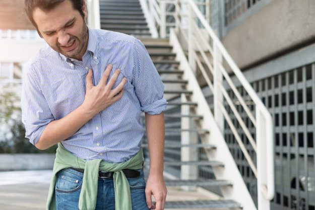 Opioids and Their Effects on Your Lungs and Respiratory System A man feeling short of breath after taking opioids.