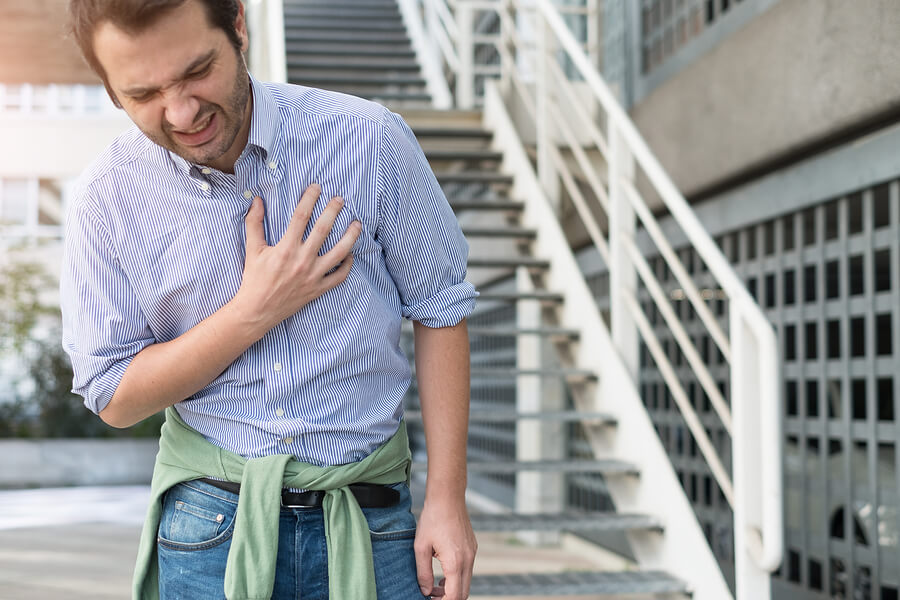 Opioids and Their Effects on Your Lungs and Respiratory System A man feeling short of breath after taking opioids.