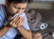A man suffering from allergy symptoms after drinking.